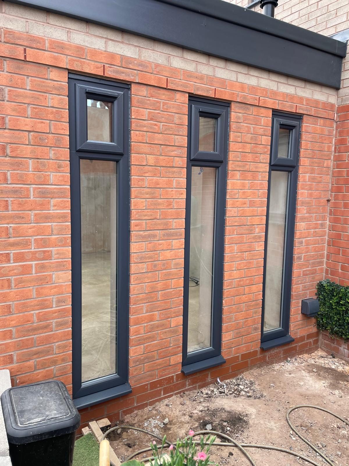 Anthracite grey windows fitted into a new brick orangery in Cannock