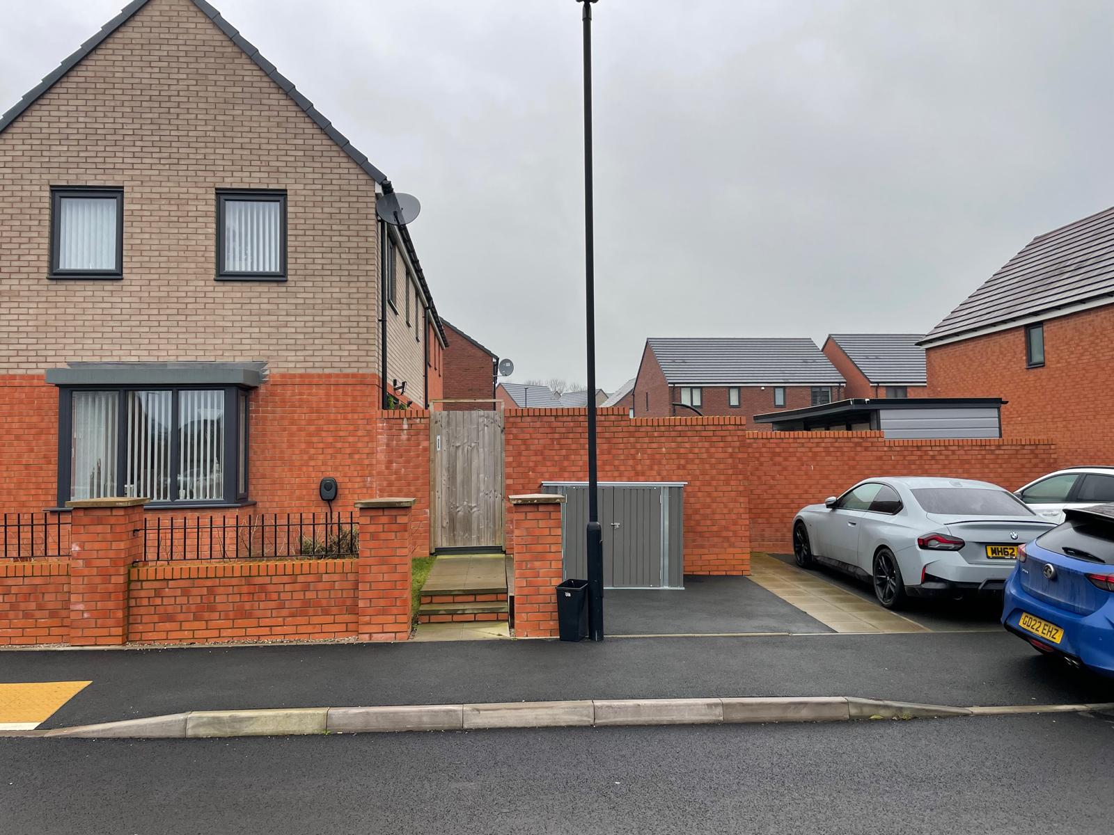 Modern housing development street with new build homes